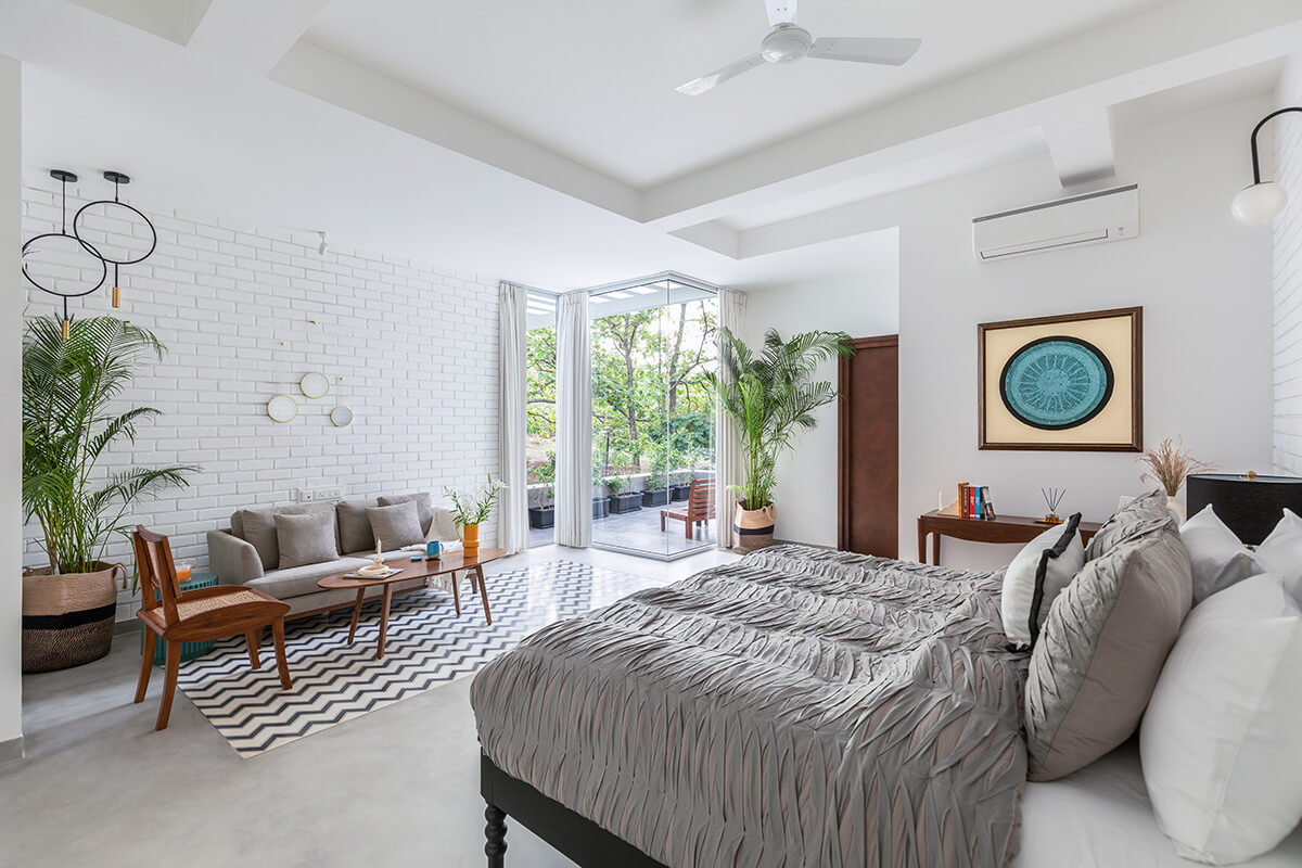 Bedroom with private balcony at villa in Assagao