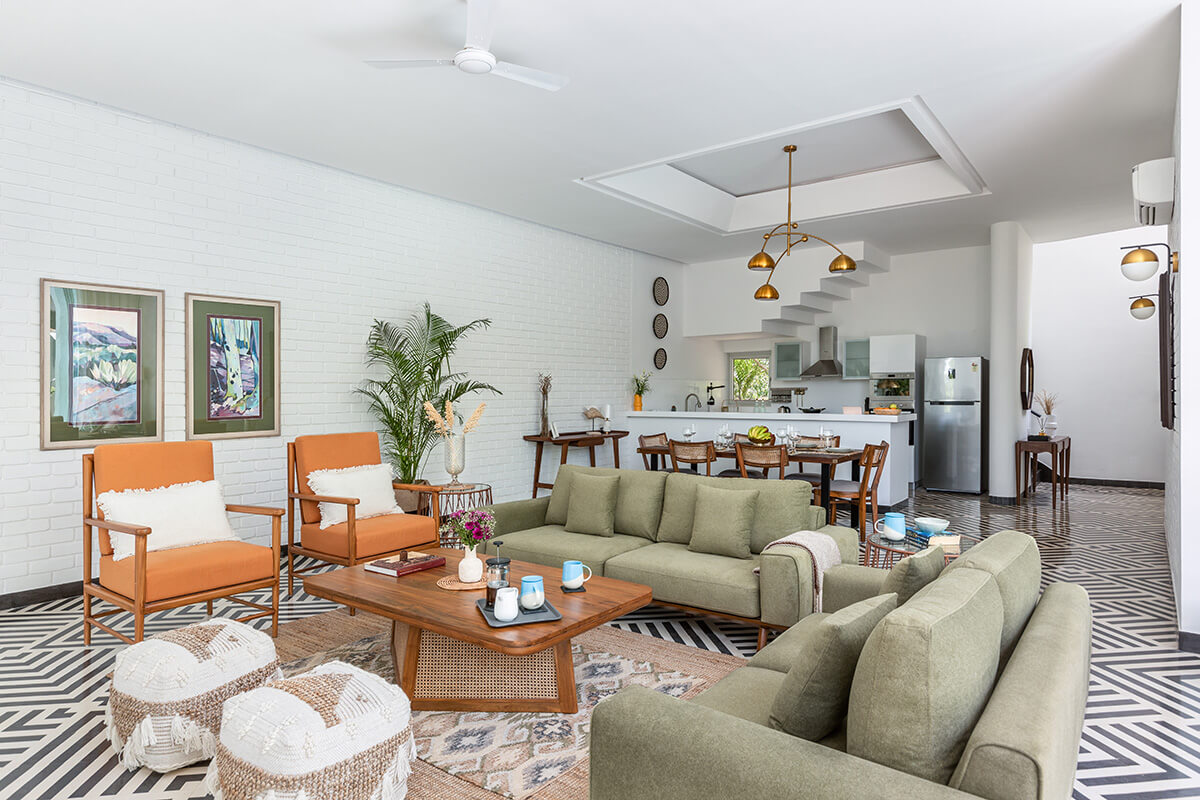 Living room with open fully euipped kitchen at a villa in Goa