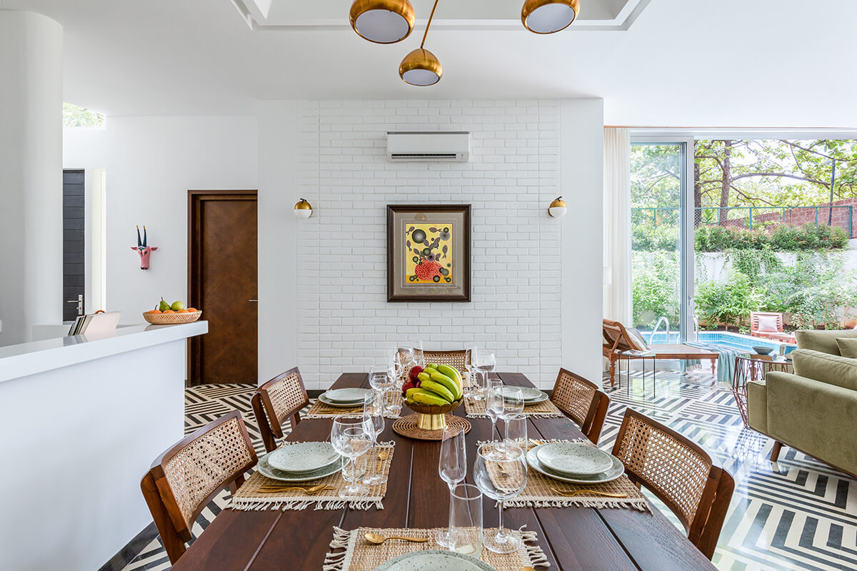 Dining table overlooking the private pool at a villa in North Goa