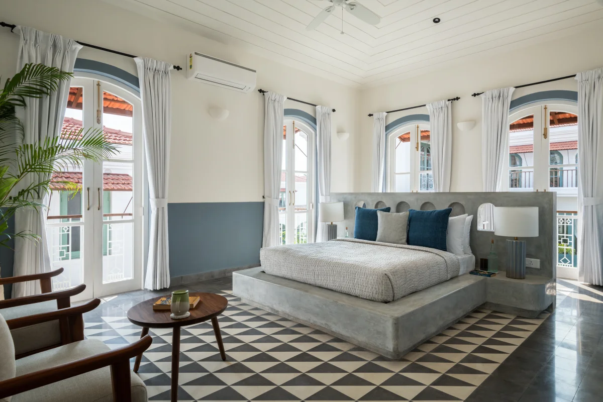 Blue and grey themed bedroom at a villa in Assagao