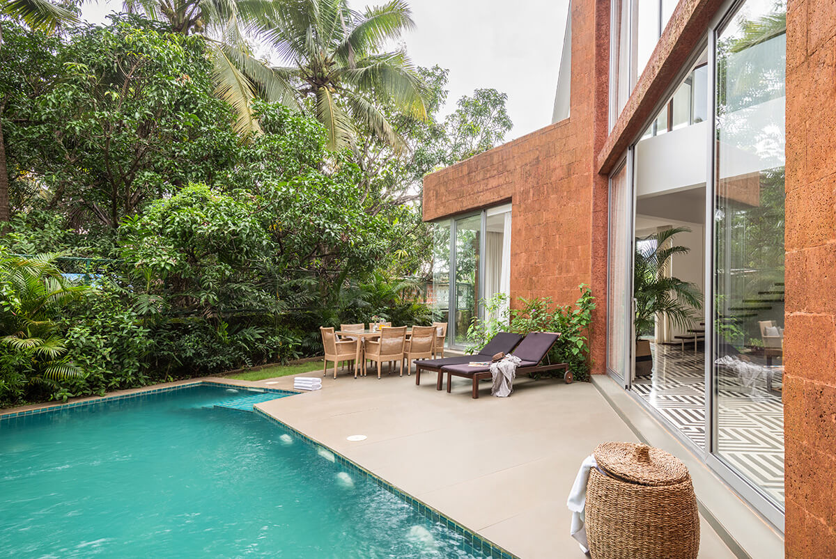 Private pool nestled between in greenery at a villa in Assagao