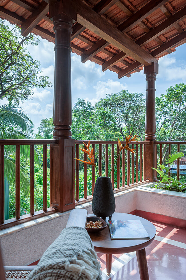 Wood finished balcony at a villa in Assagao