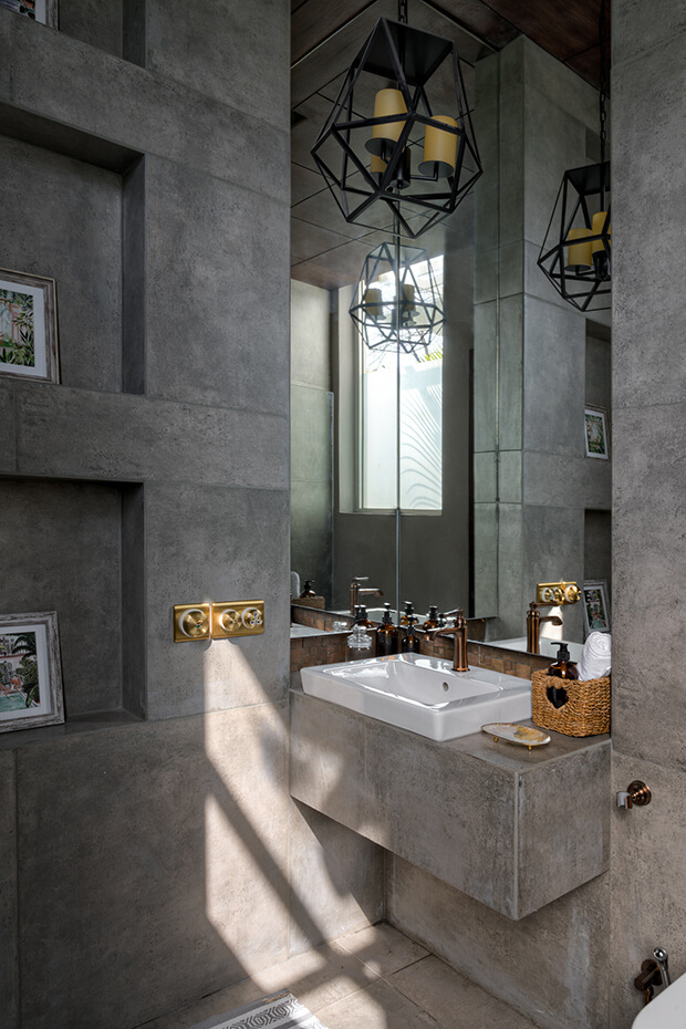 Grey IPS walled bathroom at a villa in Assagao